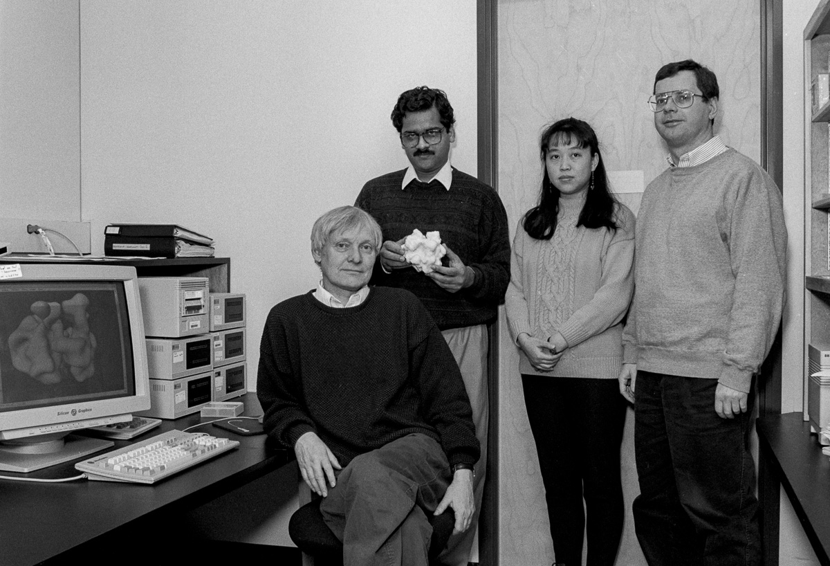 Dr. Frank, seated, displays a 3D cryo-EM model of the ribosome on a computer in this 1996 photo. 