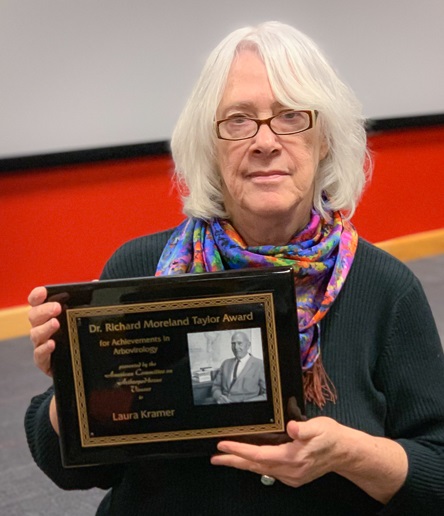 Laura Kramer, Ph.D., Director of the Arbovirology Laboratory holding the Richard M. Taylor Award