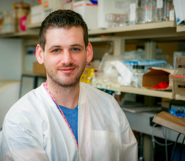Joseph Shea in labcoat