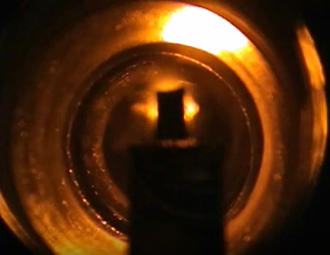 A tungsten filament excites sodium atoms A tungsten filament excites sodium atoms